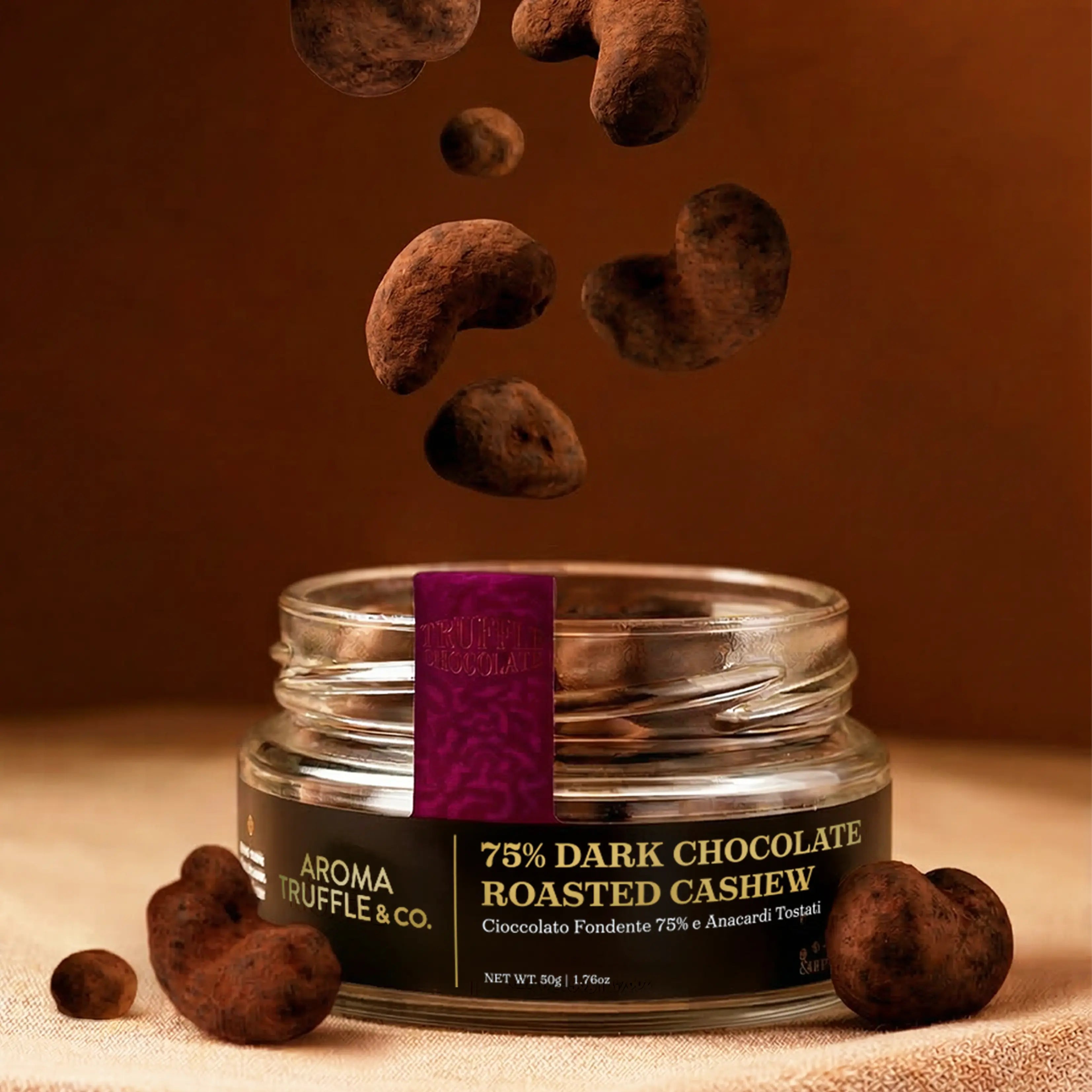 75% Dark Chocolate Roasted Cashew falling inside a 50g glass jar